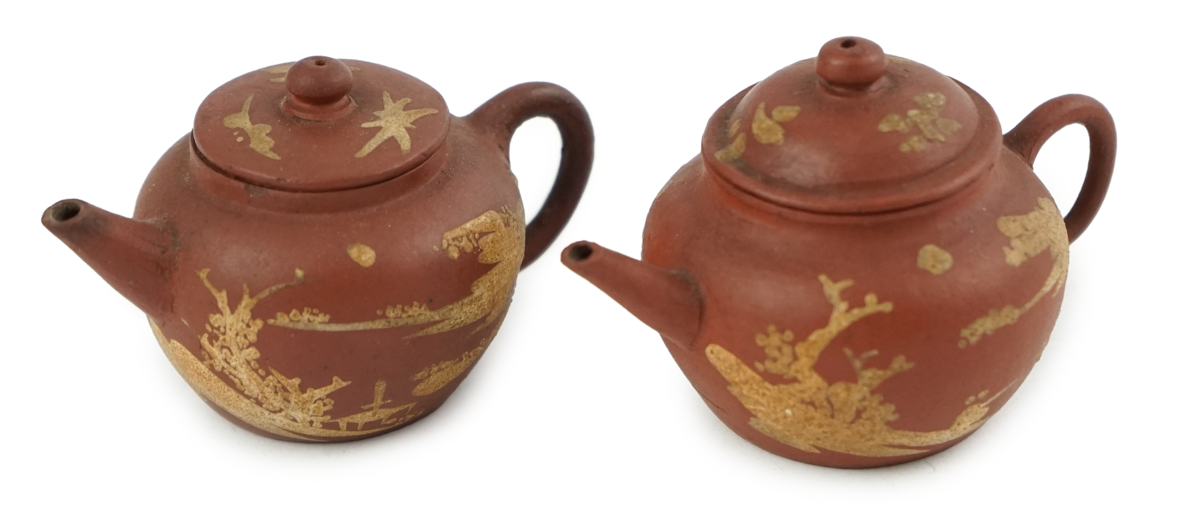 Two Chinese Yixing slip-decorated miniature teapots and covers, 18th/19th century